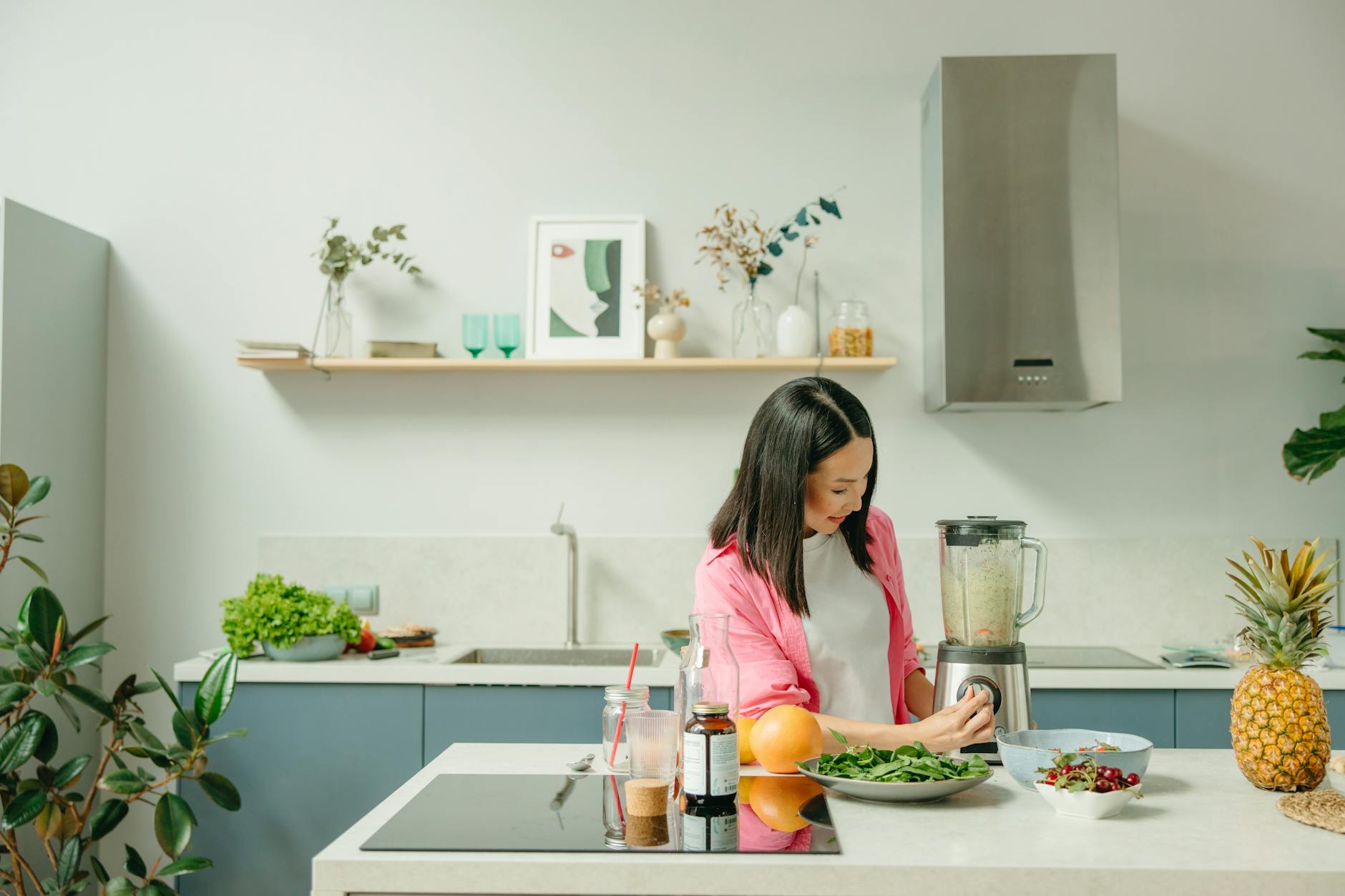 a woman using a blender